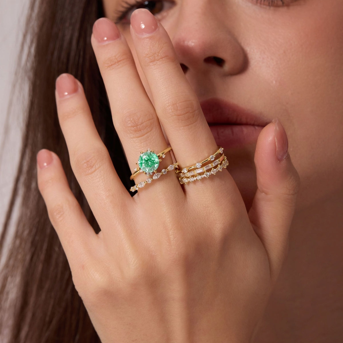 Vivid Mint Green Constellation Cluster Ring worn on a hand near the face